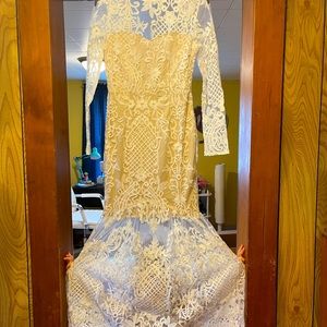 Bridal dress. Has sheer body with beige/nude interior. Brand new with tags